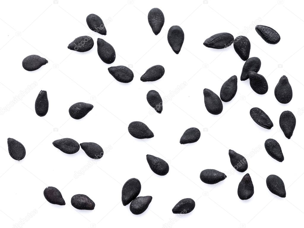 Several black sesame seeds isolated on white background. 