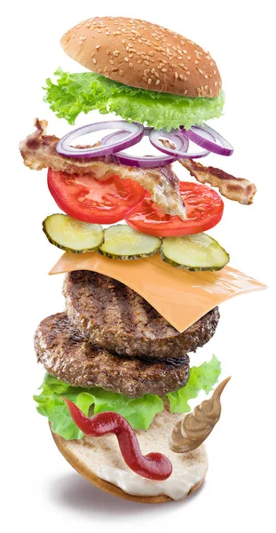 Hamburger ingredients falling down one by one to create a perfec — Stock Photo, Image