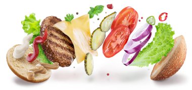 Hamburger malzemeler havada asılı. Renkli kavramsal pi