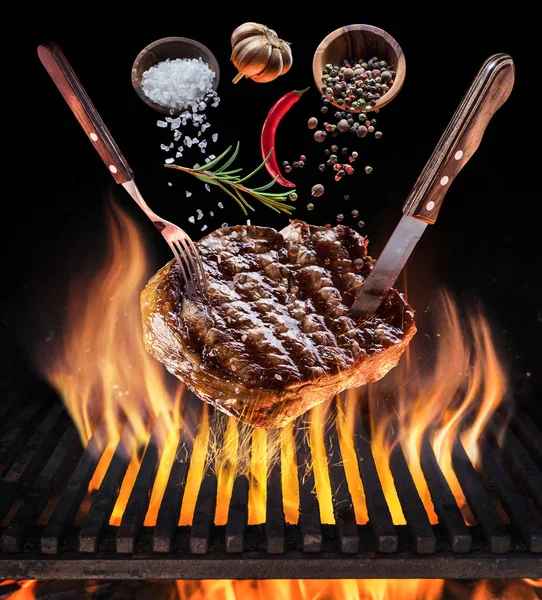 Steak cooking. Conceptual picture. Steak with spices and cutlery — Stock Photo, Image