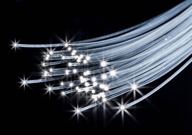 Uçları ışıklar ile optik liflerin paketi. Mavi artalan