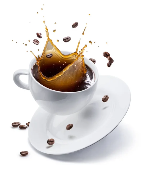Splash of coffee in white cup and coffee beans in air. Isolated — Stock Photo, Image