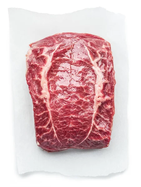 A felső penge steak vagy a marhahús steak felett papír fehér háttér — Stock Fotó