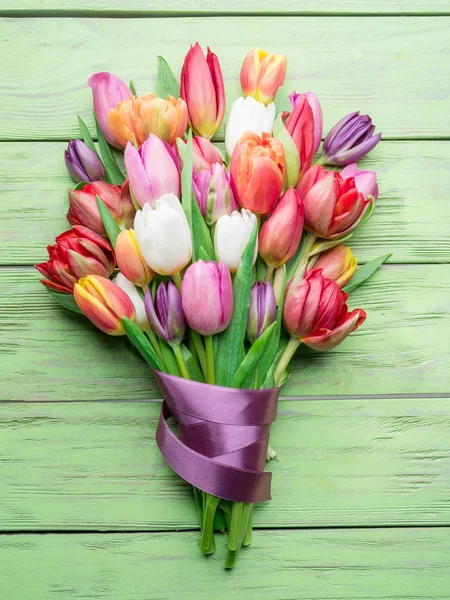 Colorful  bouquet of tulips on green wooden background. — Stock Photo, Image