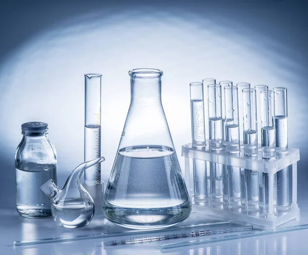 Different laboratory beakers and glassware. — Stock Photo, Image