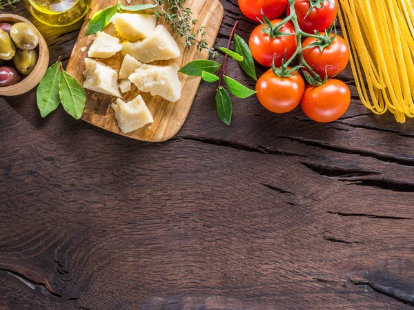 Variety of food on the wooden table. Top view.