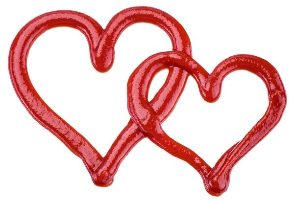 Ketchup in una forma di cuore su sfondo bianco. Il file contiene — Foto Stock