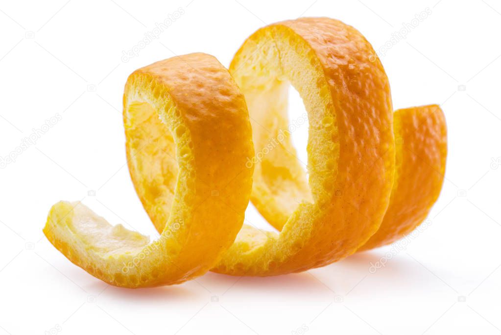 Orange peel or orange twist on white background. Close-up.