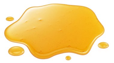 Tatlı yapışkan bal birikintisi ve bal damlaları beyaz arka planda izole edilmiş.