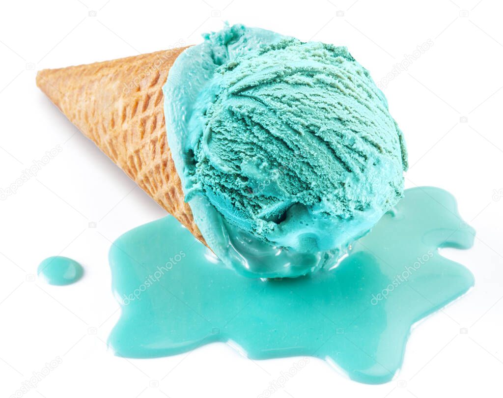 Blue melted ice cream in waffle cone on white background. Melt ice cream puddle near cone with ice. Close -up.