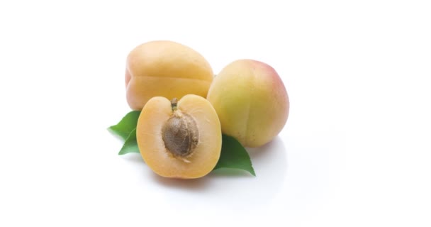 Ripe Apricots Half Apricot Leaves Isolated White Background Slowly Full — Stock Video