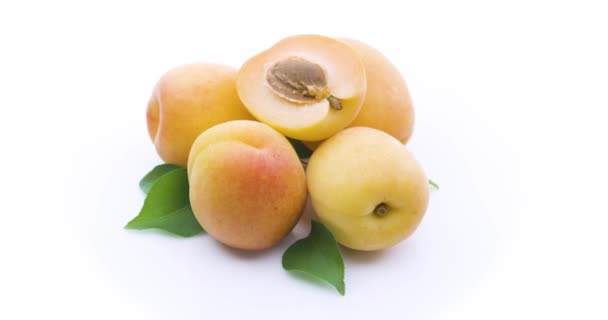 Ripe Apricots Half Apricot Leaves Isolated White Background Slowly Full — Stock Video