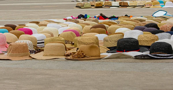 Different hats exposed on the floor