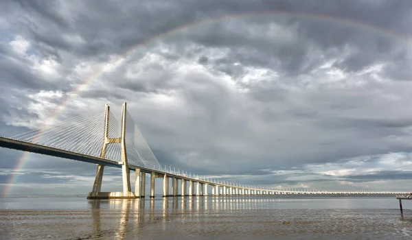 Rainbow Vasco Gama Bridge Lisbon Portugal — стокове фото