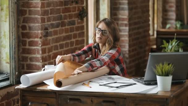 Designer Looks at Sheet of Paper — Stock Video