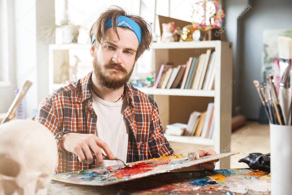 Young Male Artist Is Holding A Brush