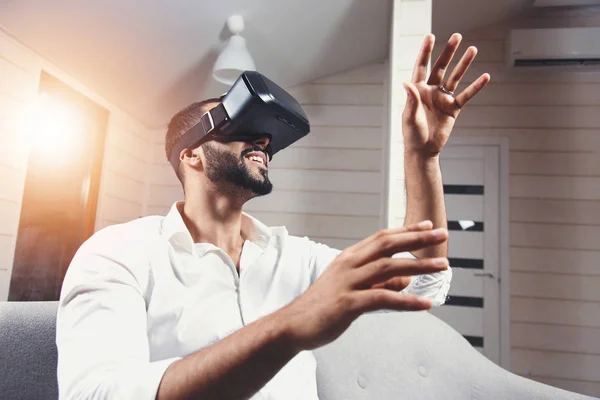 Excited Bearded Man Using Virtual Reality Goggles