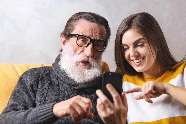 Senior Man Sitting With His Daughter