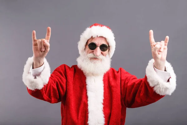 Santa Claus In The Sunglasses Standing And Showing A Rock Gesture — Stock Photo, Image