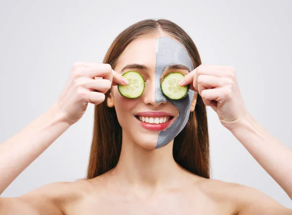 Woman with Clay Mask and Cucumbers — Stock Photo, Image