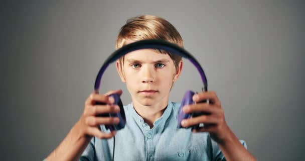 Boy Wearing Headphones Isolated — Stock Video