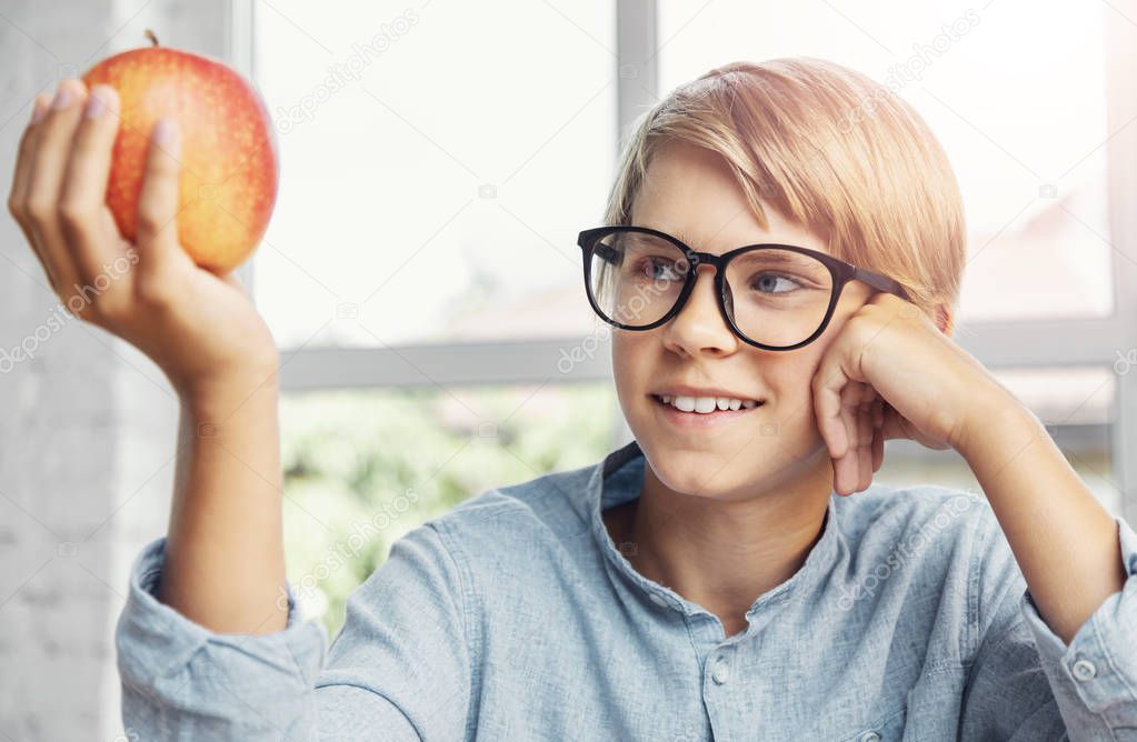 Boy Holding an Apple