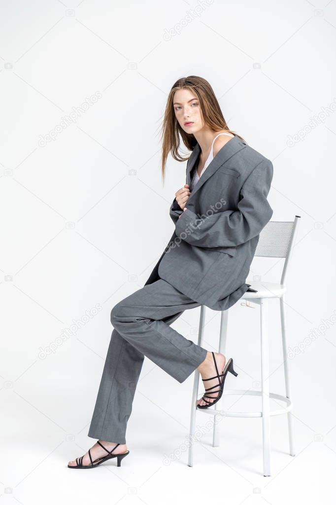 Young Beautiful Woman on a Bar Chair
