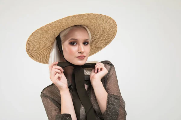 Cute Blonde in Transparent Blouse and Straw Hat