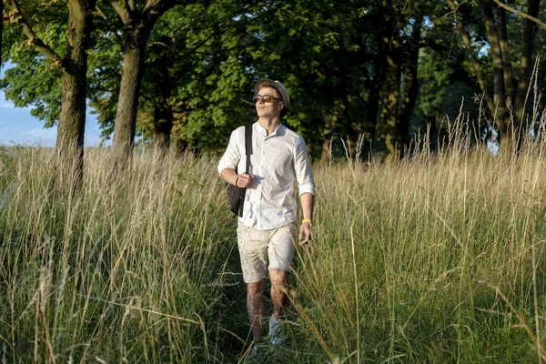 Enthusiastic Tourist Walking Through Wooded Steppe