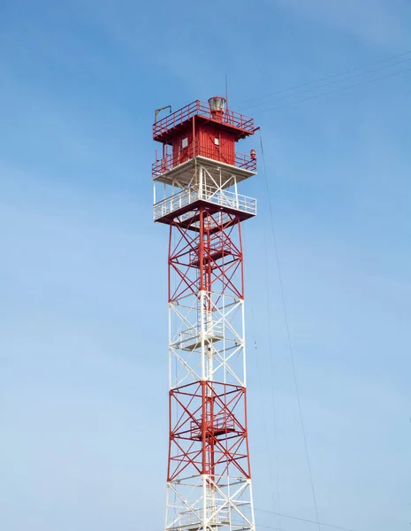 red and white color metal sea navigational lighthouse