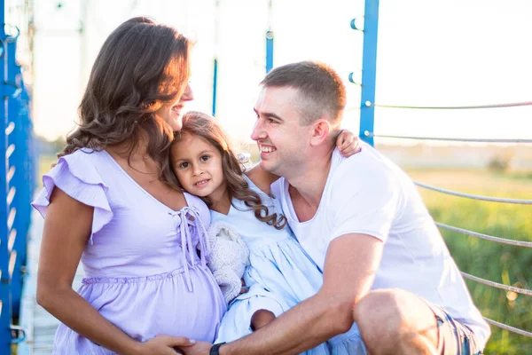 Happy Young Family Hugging Bridge Sunset Light Husband Little Girl — Stock Photo, Image