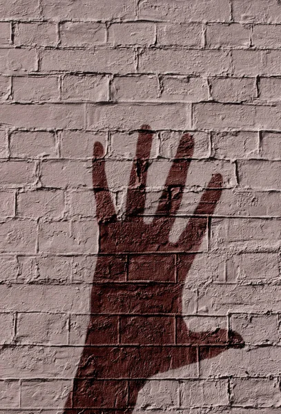 Sombra Una Mano Sobre Fondo Pared Ladrillo —  Fotos de Stock