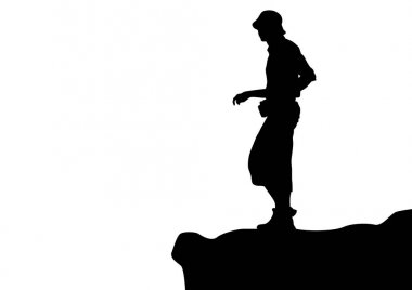 Young tourist on the edge of a high mountain