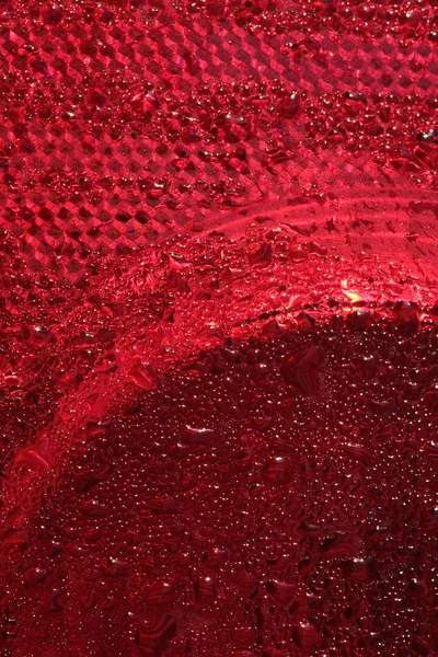 Csepp Piros Folyadék Műanyag Felületen — Stock Fotó