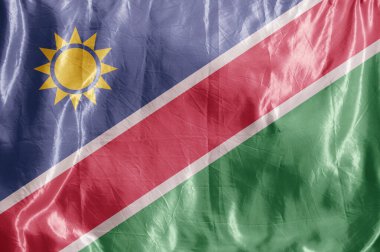 Eyalet bayrağı rüzgarda dalgalanıyor. Tekstil üzerine renkli arkaplan