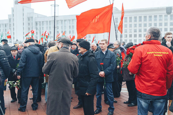 November 7, 2018 - Minsk, Belarus: Anniversary of Great October Socialist Revolution, group of people standing on square with flags