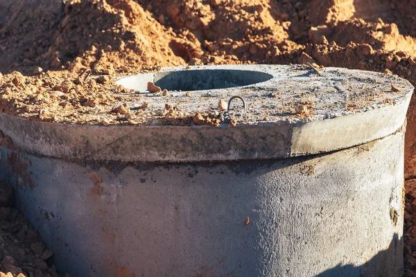 Concrete well at the construction site for water pipes — Stock Photo, Image