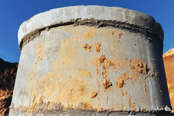 Concrete well at the construction site for water pipes