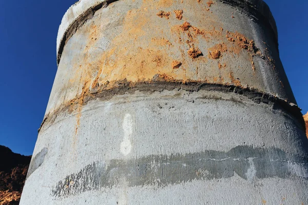 Concrete well at the construction site for water pipes and sewage