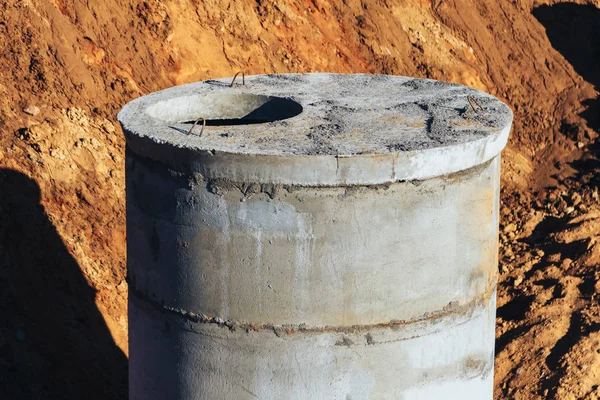 Concrete well at the construction site for water pipes