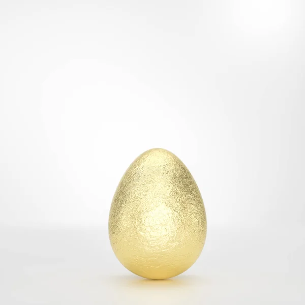 Jeden zlatý velikonoční vajíčko na bílém pozadí — Stock fotografie