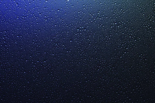 Σταγονίδια νερού σε διάφανο φόντο από γυαλί ουράνιου τόξου με gr — Φωτογραφία Αρχείου