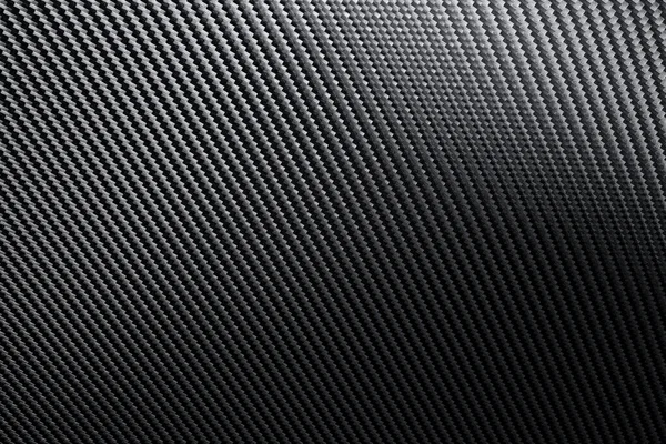 Structural detail of an industrial carbon fibre sheet in a full frame view showing the repeat diagonal pattern as light plays across the surface in a background texture
