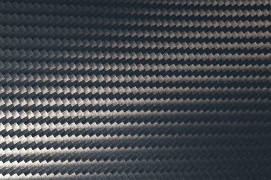 Gri karbon fiber doku yüzeyinin makro fotoğrafı. Doku ve şablon arka planı. Modern teknoloji ve malzeme konsepti.