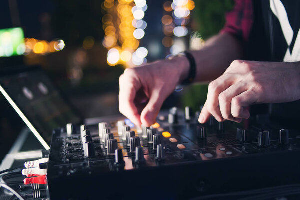 dj play in nightclub.Hands mixing music on professional equipment