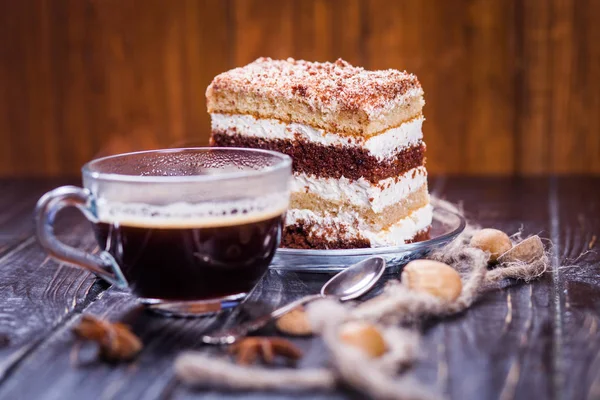 transparent cup of hot coffee near the puff cake and rope