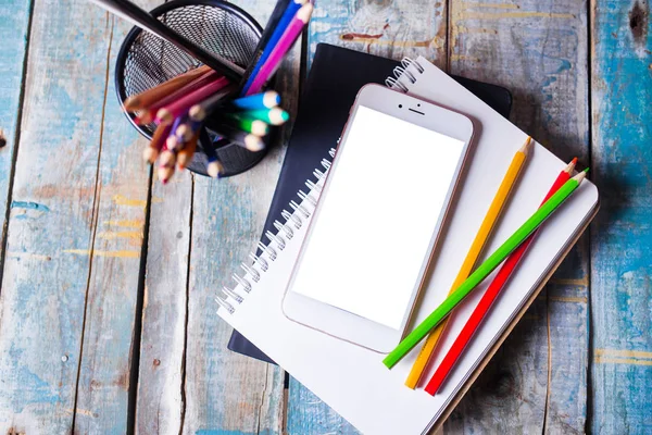 Table with notepad ,smartphone — Stock Photo, Image