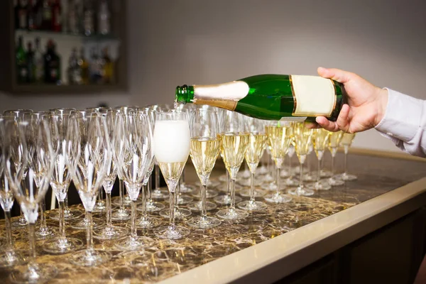 waiter pouring champagne