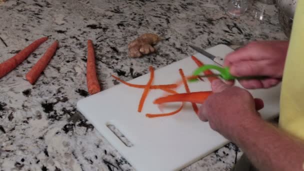 Man Peeling Organic Carrots White Plastic Cutting Board Male Hands — Stock Video