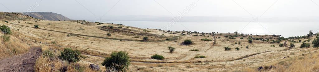 Kinnereth lake and dirt road in Galilee in Israel